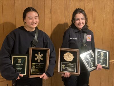 Cece Zhao - EMT of the Year and Emma Hansen - Firefighter of the Year display their awards.